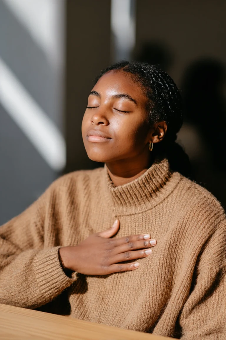 A teenage girl with anxiety, practising deeper breathing at home.