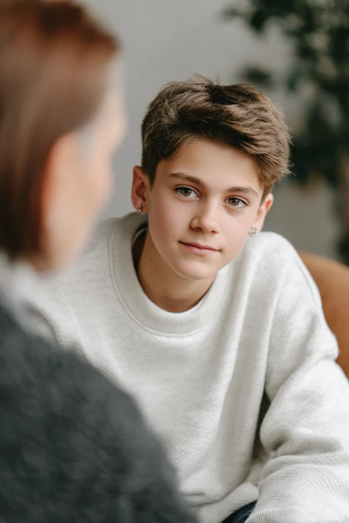 a teenage boy talking to a therapist
